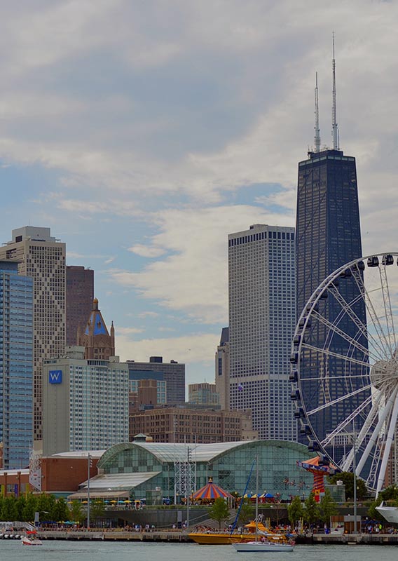 Chicago's Navy Pier and the Chicago skyline on a sunny day.